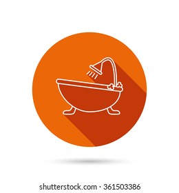 Bathroom icon. Bath with shower sign. Round orange web button with shadow.