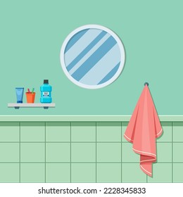 El interior del cuarto de baño tiene un gran espejo redondo.