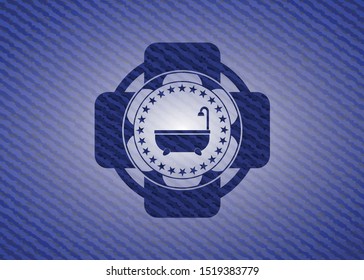 bathtub icon inside emblem with denim high quality background