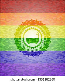 bathtub icon inside emblem on mosaic background with the colors of the LGBT flag