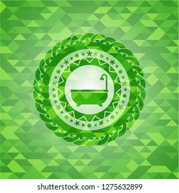 bathtub icon inside green emblem with mosaic background
