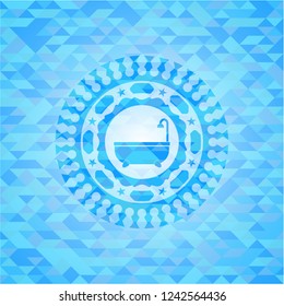 bathtub icon inside sky blue emblem with mosaic background