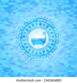 bathtub icon inside sky blue emblem with mosaic background