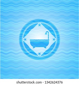bathtub icon inside water wave badge.