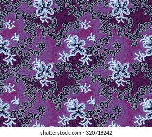 Batik beautiful vintage design background with purple flower.