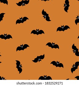 Bats on an orange background, seamless pattern. Halloween design. Creative design background of web sites wallpapers covers wrappers for Halloween Textile pattern, print pattern. 