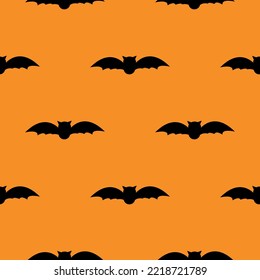 Bats on orange background seamless pattern 