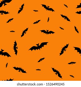 Bats seamless pattern on orange background. For Halloween.