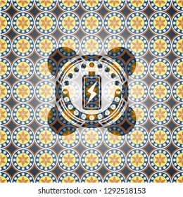 battery charging icon inside arabesque emblem background. arabic decoration.