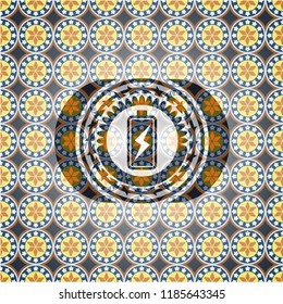 battery charging icon inside arabic badge. Arabesque decoration.