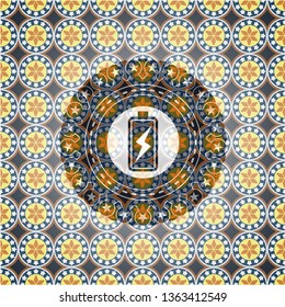 battery charging icon inside arabic style badge. Arabesque decoration.