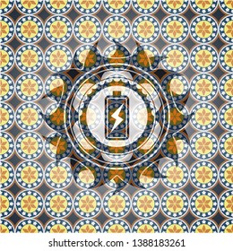 battery charging icon inside arabic badge background. Arabesque decoration.