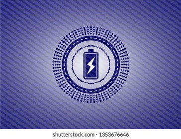 battery charging icon inside badge with jean texture