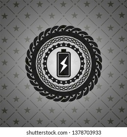 battery charging icon inside black emblem