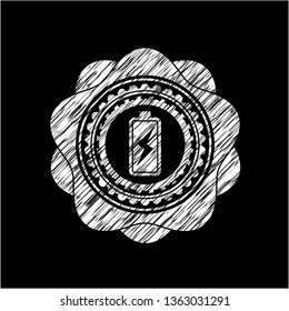 battery charging icon inside chalk emblem written on a blackboard