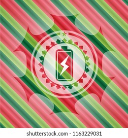 battery charging icon inside christmas colors style emblem.
