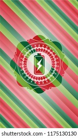 battery charging icon inside christmas style emblem.