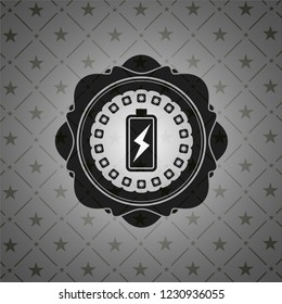 battery charging icon inside dark emblem. Retro