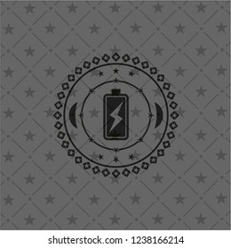 battery charging icon inside dark badge or emblem