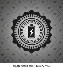 battery charging icon inside dark emblem. Retro