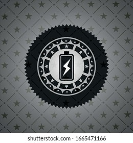 battery charging icon inside dark badge or emblem