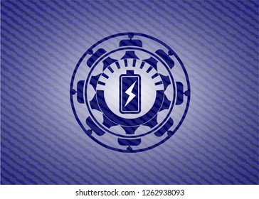 battery charging icon inside denim background