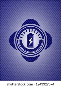 battery charging icon inside emblem with denim high quality background
