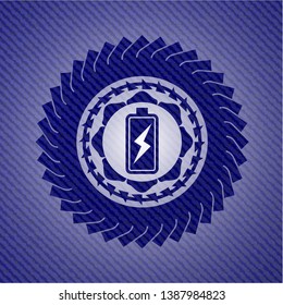 battery charging icon inside emblem with jean background