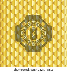 battery charging icon inside golden badge or emblem. Scales pattern. Vector Illustration. Detailed.