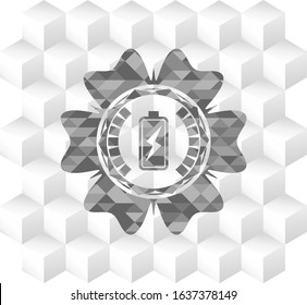 battery charging icon inside grey emblem with cube white background