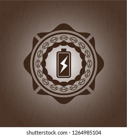 battery charging icon inside realistic wood emblem