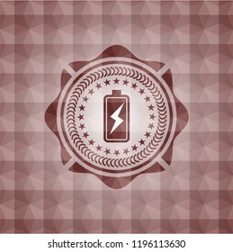 battery charging icon inside red seamless emblem with geometric background.