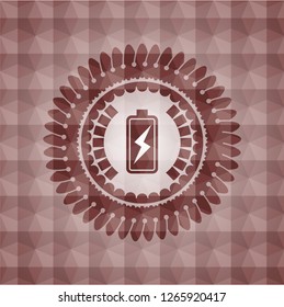 battery charging icon inside red seamless badge with geometric pattern background.