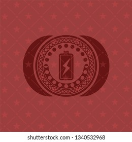 battery charging icon inside red emblem. Retro