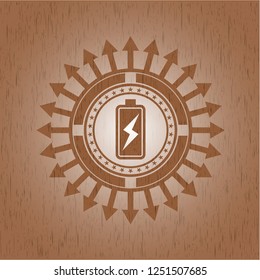battery charging icon inside retro wood emblem