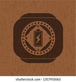 battery charging icon inside retro wooden emblem