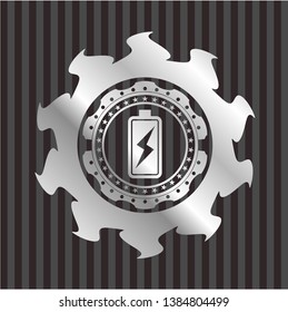 battery charging icon inside silver emblem or badge