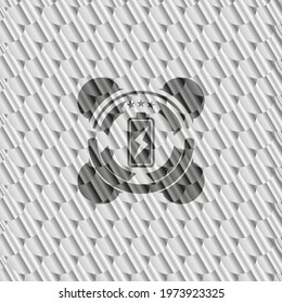 battery charging icon inside silver badge or emblem. Scales pattern. Vector Illustration. Detailed. 
