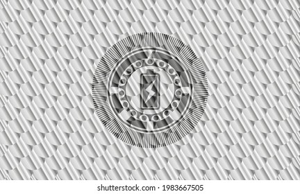battery charging icon inside silver badge. Scales pattern. Vector Illustration. Detailed. 