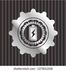 battery charging icon inside silvery emblem or badge