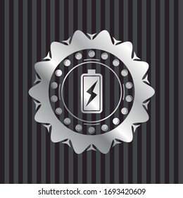 battery charging icon inside silvery emblem or badge