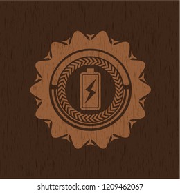 battery charging icon inside vintage wood emblem