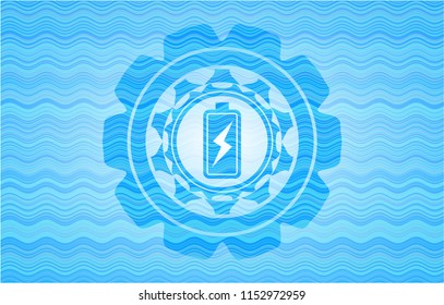 battery charging icon inside water representation emblem background.