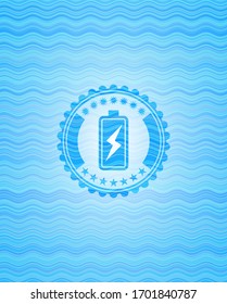 battery charging icon inside water representation emblem.