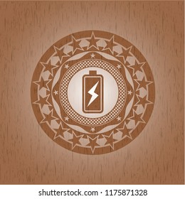 battery charging icon inside wooden emblem. Retro