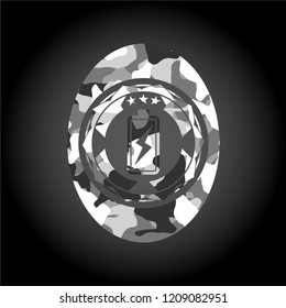 battery charging icon on grey camo texture