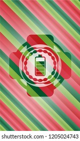 battery icon inside christmas style emblem.