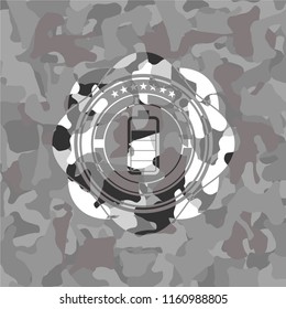 battery icon inside grey camouflaged emblem