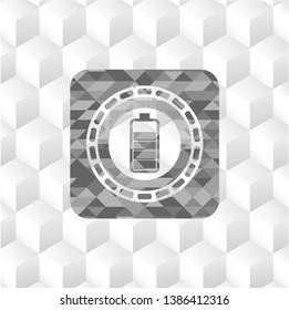 battery icon inside grey emblem with geometric cube white background
