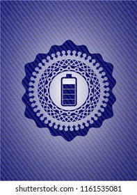 battery icon inside jean or denim emblem or badge background